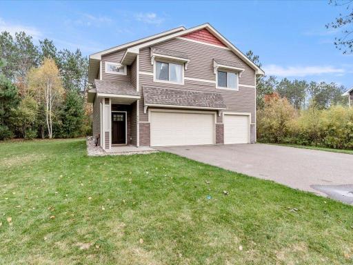 Notice the long driveway, spacious front yard and trees surrounding the backyard