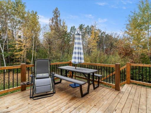 Getaway from the hustle and enjoy the peaceful deck surrounded by trees and wild life
