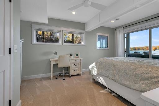 Located just off the lower-level family room, this bedroom offers a comfortable space for guests, with room for additional furnishings or a small workspace.