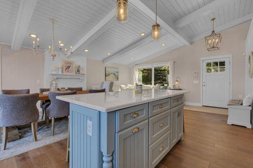 The kitchen, dining, and living areas come together in one inviting space, making it easy to stay connected whether cooking, entertaining, or relaxing by the fireplace.
