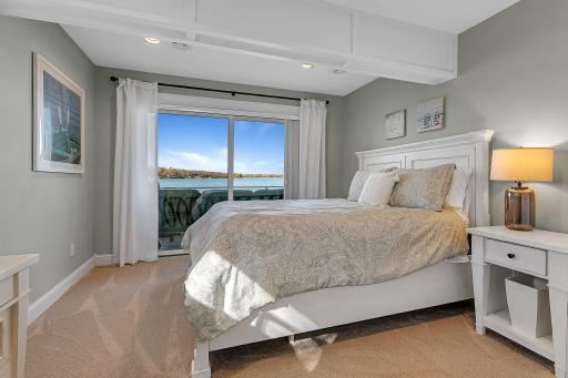 Your guests may never want to leave! This lower-level bedroom offers beautiful views of Lake Sylvia and sliding glass doors that open directly to the deck.