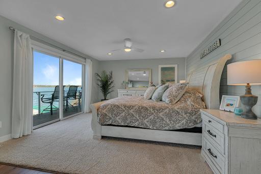 Start and end your day overlooking Lake Sylvia! The primary bedroom offers a relaxing retreat with sliding glass doors opening directly to the deck, where beautiful water views await.
