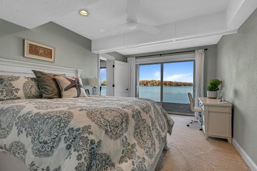 The second lower-level bedroom offers a comfortable retreat with beautiful views and sliding doors to the deck. Its location opposite the other bedroom provides welcome separation.