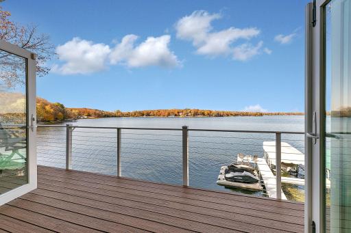 Enjoy sweeping views of Lake Sylvia from the maintenance-free deck, overlooking the shoreline, dock, and expansive open water.