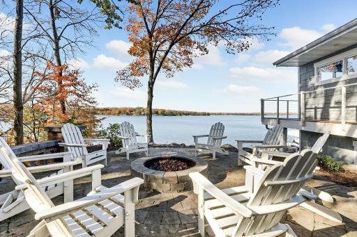Imagine evenings spent around the fire, sharing stories, roasting marshmallows, and enjoying the peaceful waterfront setting. This lakeside firepit patio is sure to be a favorite gathering place!