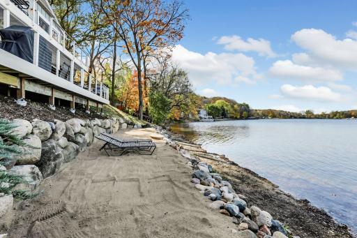 Enjoy the sandy beach area just steps from the water, complete with a boulder retaining wall and easy access to the shoreline. Lake days don't get much better than this!