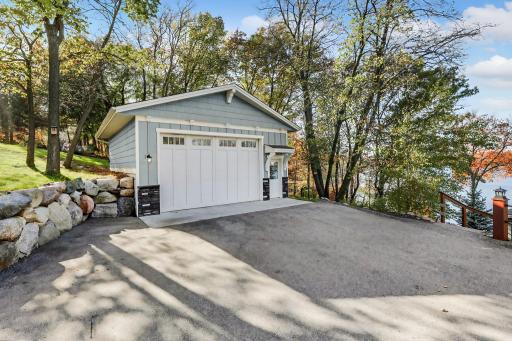 A detached, insulated, heated, and finished two-car garage completes the property.