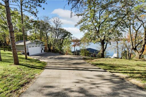 Surrounded by mature trees and situated on a quiet dead-end road, the property offers exceptional privacy.