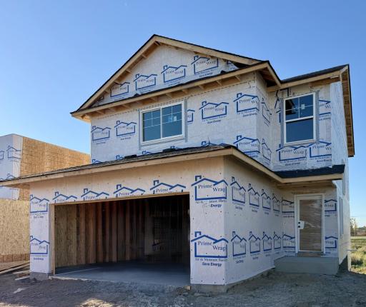 9745 31st St NE- Photo of home currently under construction offering an late Dec./early Jan. move-in. Highlights include a Walkout Lower Level ready for future finish. Front stoop column and siding will be installed soon.