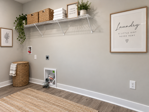 Oversized upper-level laundry room provides exceptional space for storage, folding, and organization. *Photo of similar home. Virtually staged.