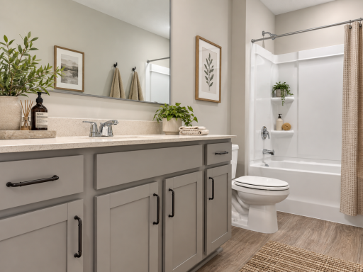 Upper level main full bathroom. *Photo of similar home. Virtually staged.
