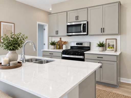 Quartz countertops, stainless steel appliances, and a gas range add the perfect finishing touch to this spacious kitchen. *Photo of similar home. Virtually staged.