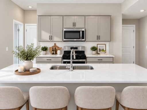 With an oversized island at the center, this spacious kitchen offers plenty of room for cooking, hosting, and gathering with family and friends. *Photo of similar home. Virtually staged.