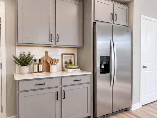 A versatile countertop and cabinet area creates the ideal coffee nook, command center, or convenient drop zone. *Photo of similar home. Virtually staged.