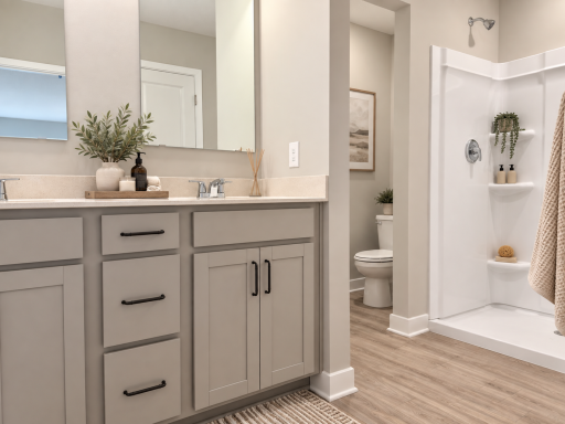 The spacious primary ensuite features dual vanities, a 5-foot shower, and a linen closet for added storage and convenience. *Photo of similar home. Virtually staged.