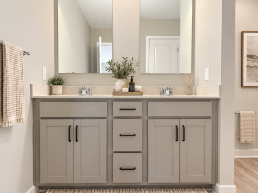 Dual vanities provide plenty of space to get ready and stay organized. *Photo of similar home. Virtually staged.