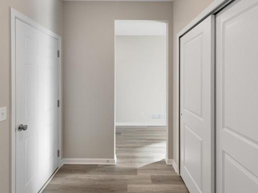PHOTO OF A DIFFERENT HOME WITH SIMILAR PLAN. FINISHES MAY VARY. Mudroom.