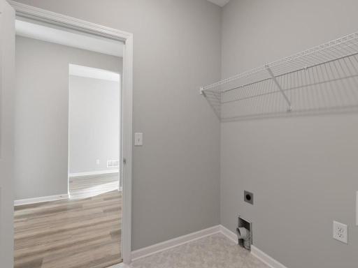 PHOTO OF A DIFFERENT HOME WITH SIMILAR PLAN. FINISHES MAY VARY. Laundry Room.