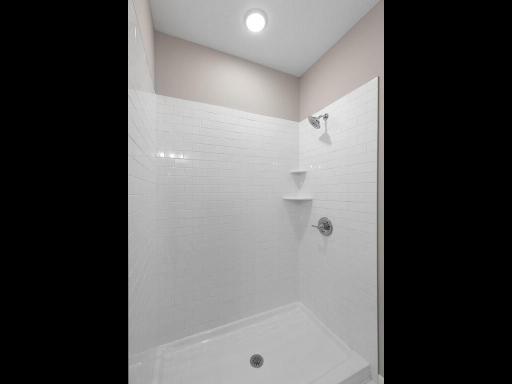 PHOTO OF A DIFFERENT HOME WITH SIMILAR PLAN. FINISHES MAY VARY. Primary Bath Shower.