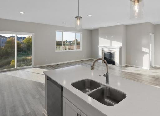 PHOTO OF A DIFFERENT HOME WITH SIMILAR PLAN. FINISHES MAY VARY.