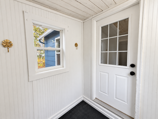 Brightened entryway with glazed white door-2.png