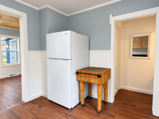 Brightened kitchen with butcher-block cart-17.png