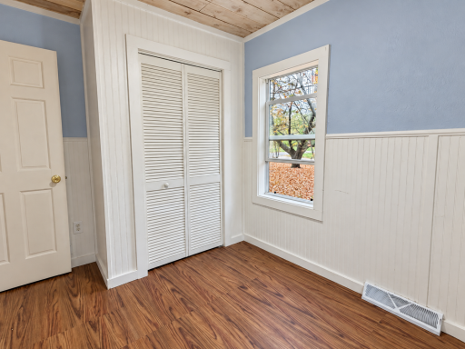 Brightened Empty Bedroom with Louvered Closet-7.png