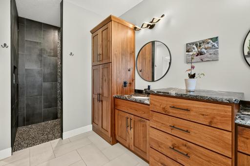 Step-in ceramic tile shower in the primary bath.