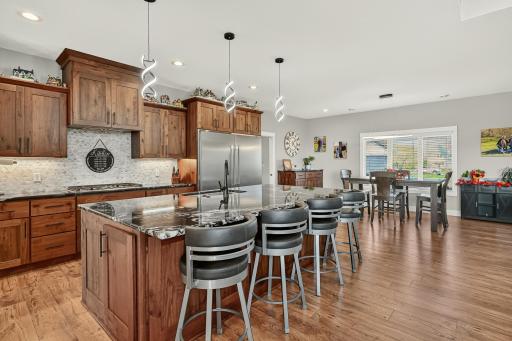 Open kitchen with huge granite island with seating.
