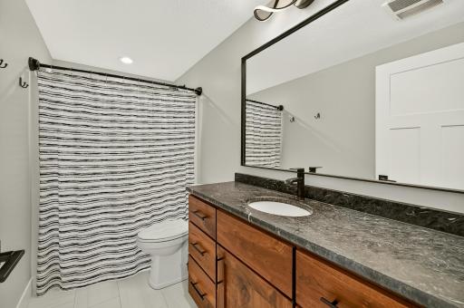 Upper Level 3/4 bath with step in shower.