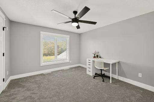 Another upper level bedroom with large closet.