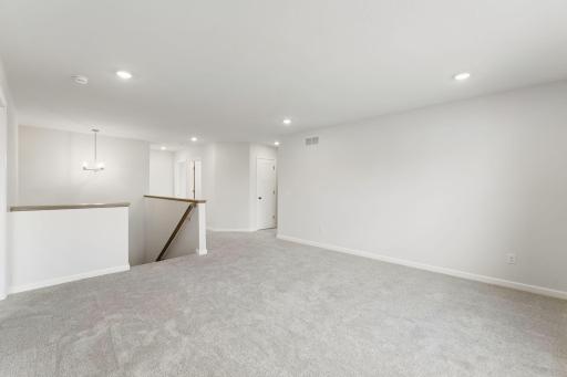 For representational purposes only. Escape to the inviting upper level loft, a flexible living area ideal for movie nights, reading, gaming or creating your own private retreat. (model photo)
