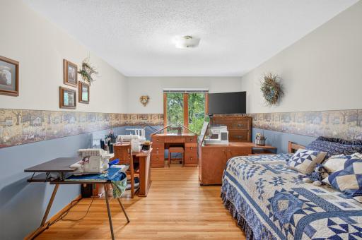 Spacious bedroom #4. Currently being used as a sewing room. A great spot for an office, reading area, or TV room.