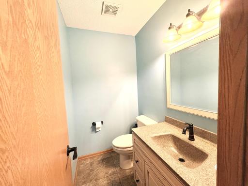 1/2 Bath off kitchen and garage entrance.
