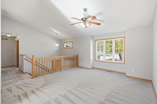 Large window and vaulted ceilings make the Upper Level Living Room bright and light-filled!