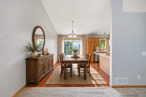 Informal Dining Area just off the Kitchen and Living Room is the perfect space for family gatherings! Virtually Staged