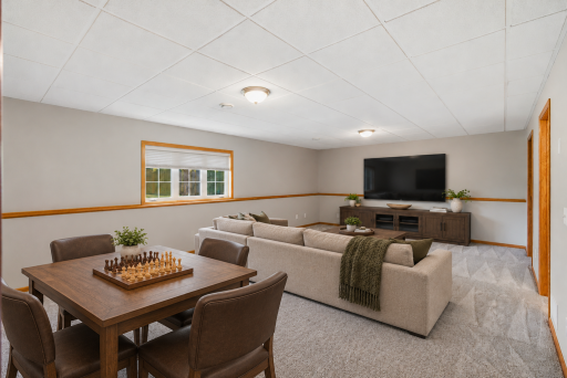 Large Lower Level Family Room is the perfect place for movie night and/or games with family and friends! Virtually Staged