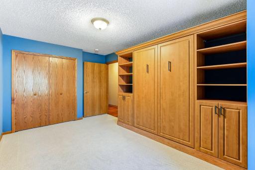 Use the room as an office and pull down the bed if you need it for guests