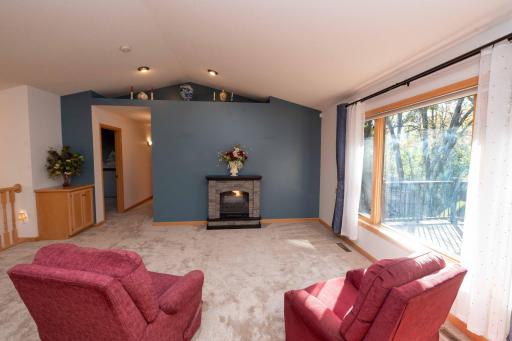 A large picture window overlooks the deck.
