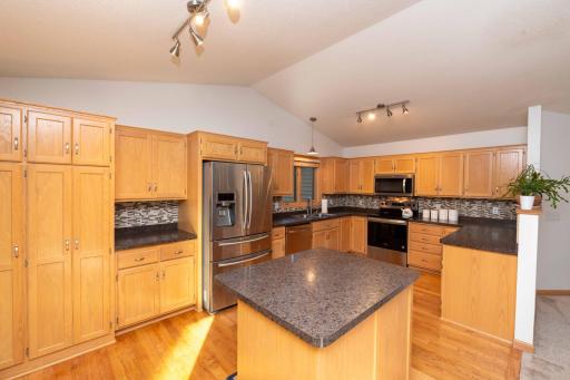Spacious kitchen with a center island and abundant cabinetry.