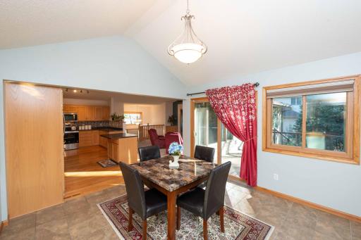 Bright dining room with backyard views and sliding doors to the deck.