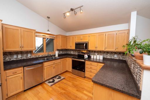 A mosaic backsplash adds a decorative touch.