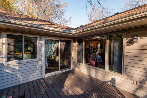 Sliding doors connect the deck to the main living spaces.