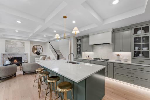 Open Kitchen with Oversized Island and Brass Pendants