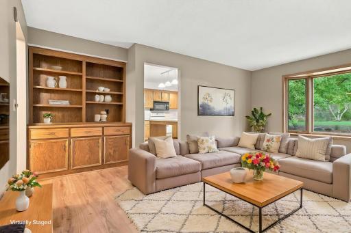 Virtually staged living room with custom built in