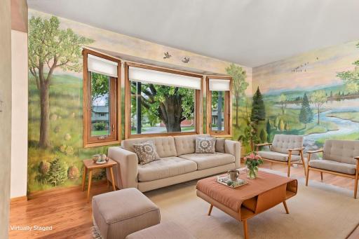 Virtually staged family room with large windows looking out to the front yard