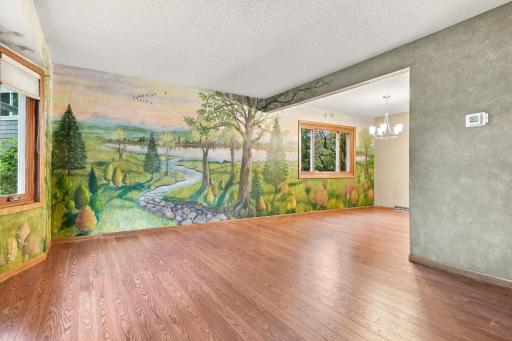Family room and dining room with custom wall mural