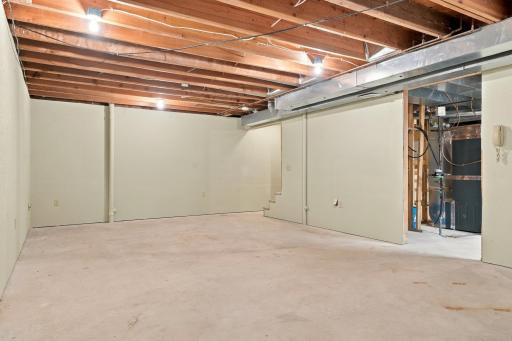 Unfinished basement provides a blank canvas for an additional family room