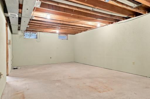 Unfinished basement provides a blank canvas for a multi purpose space