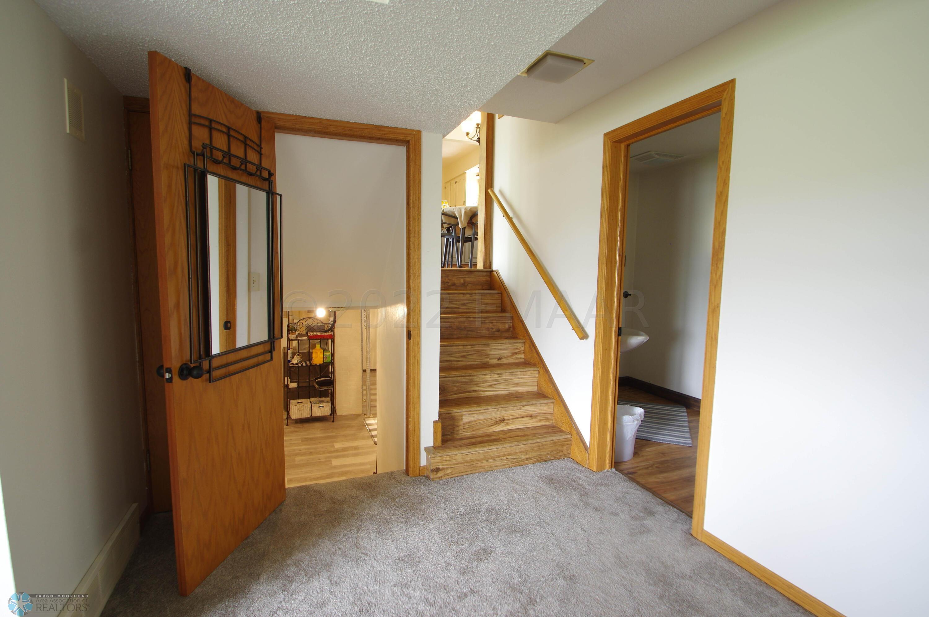 Lower level looking up and down stairs 1